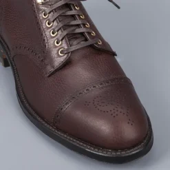 Alden Straight perforated cap toe boot in brown country calf grained leather